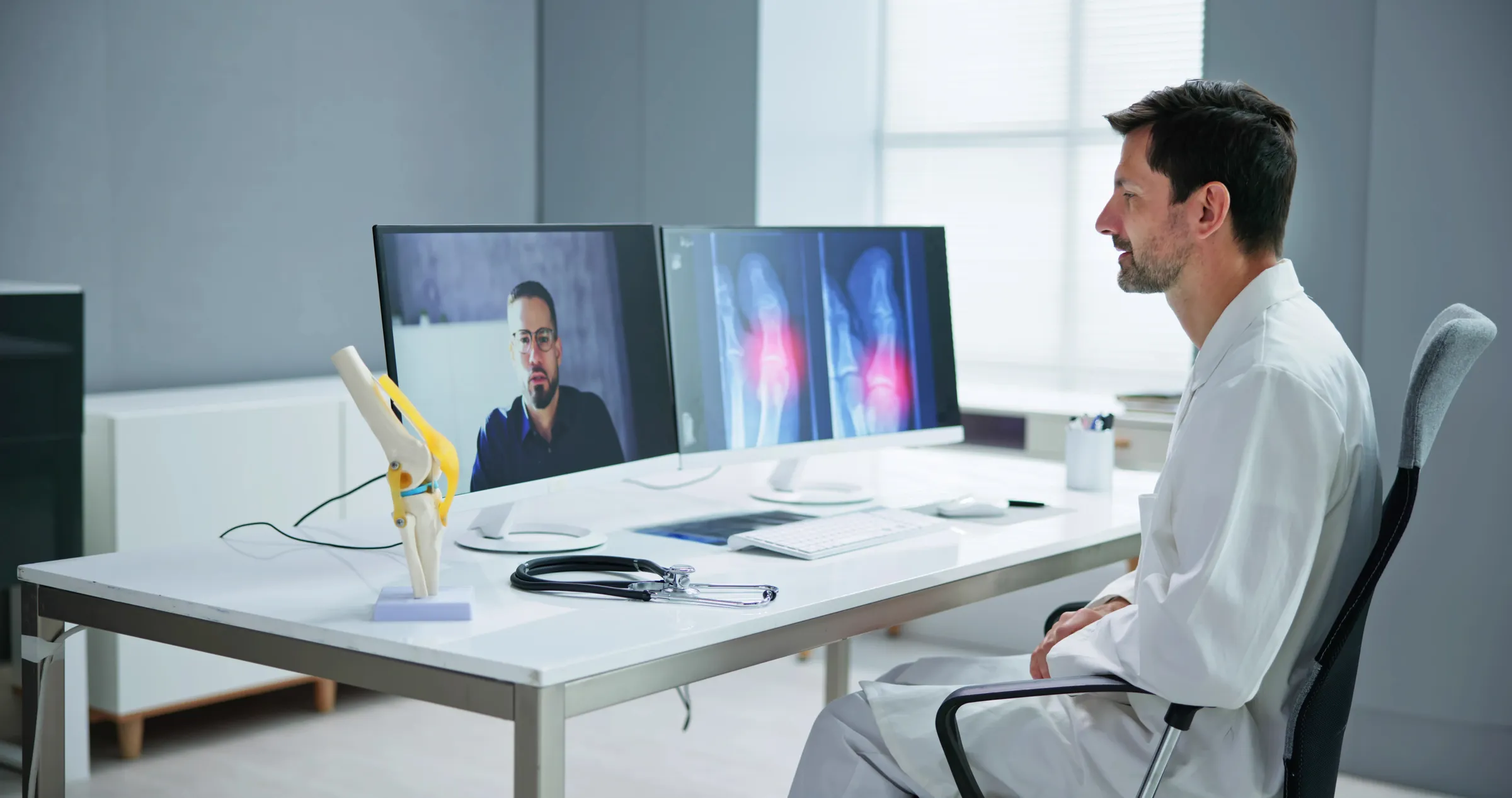 A specialist reviewing imaging with a rural patient over video
